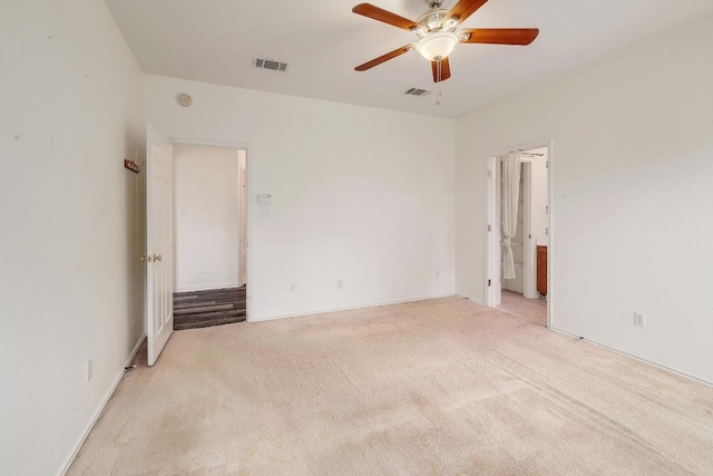 408 Wiley St, Hutto, TX 78634 - unfurnished bedroom with carpet flooring, ceiling fan, and ensuite bathroom