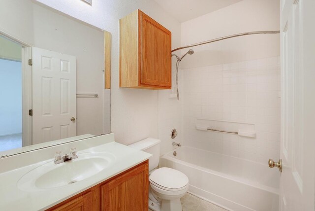 full bath featuring tub / shower combination, toilet, and vanity