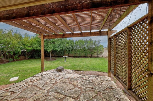 view of patio / terrace with a pergola and a fenced backyard