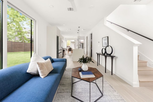 3209 Dolphin Dr Unit 2, Austin, TX 78704 - living area with light wood finished floors and stairs