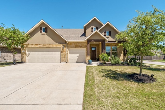 20401 Great Egret Ln, Pflugerville, TX 78660 - view of front of house with driveway, a garage, stone siding, stucco siding, and a shingled roof