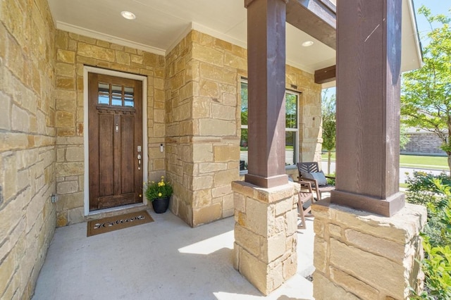 20401 Great Egret Ln, Pflugerville, TX 78660 - view of exterior entry featuring a porch and stone siding