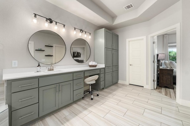 20401 Great Egret Ln, Pflugerville, TX 78660 - bathroom with vanity and rail lighting