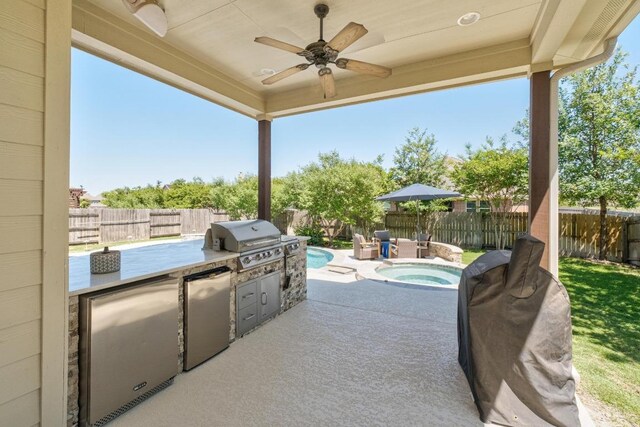 20401 Great Egret Ln, Pflugerville, TX 78660 - fenced backyard featuring exterior kitchen, an in-ground hot tub, ceiling fan, and a patio area