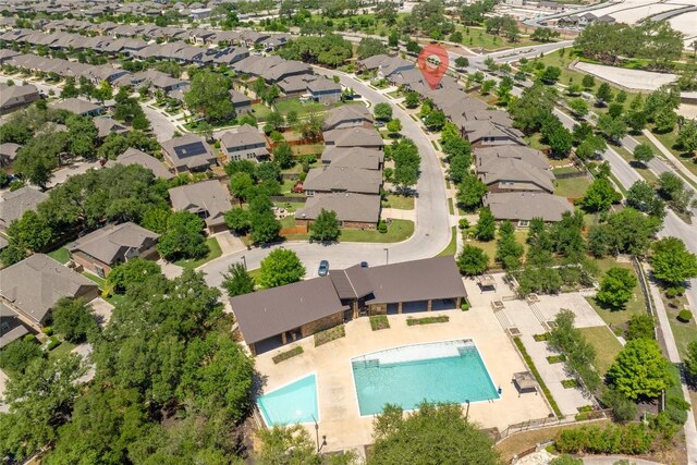 birds eye view of property with a residential view