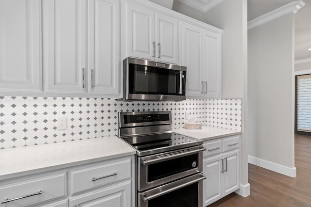 8 Cove Creek Ln, Austin, TX 78738 - kitchen featuring stainless steel appliances, crown molding, decorative backsplash, white cabinetry, and light countertops