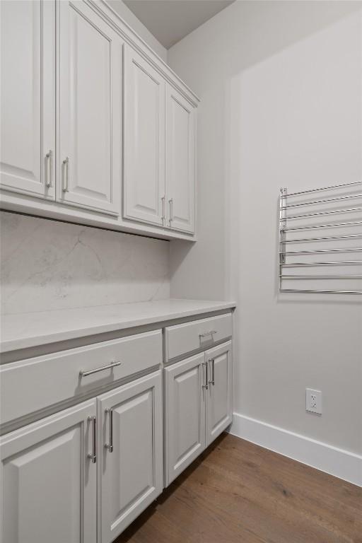 8 Cove Creek Ln, Austin, TX 78738 - laundry room featuring dark wood-style floors and baseboards