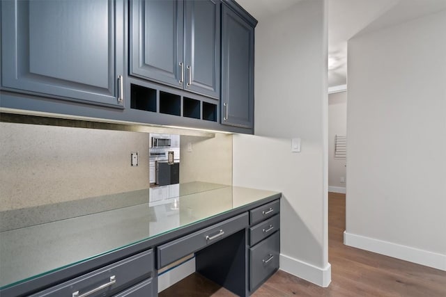 8 Cove Creek Ln, Austin, TX 78738 - unfurnished office with baseboards and dark wood-style flooring
