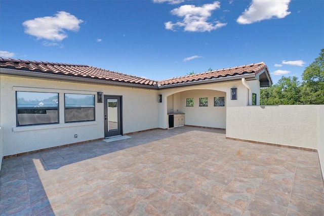 8 Cove Creek Ln, Austin, TX 78738 - back of house featuring a patio and stucco siding