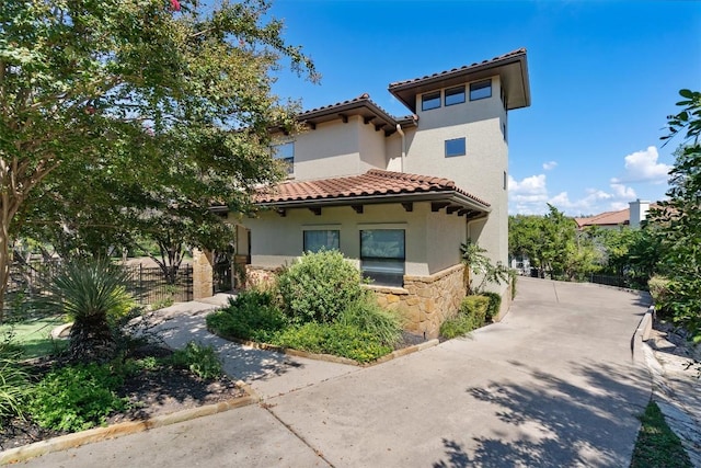 8 Cove Creek Ln, Austin, TX 78738 - view of front of home featuring stone siding, stucco siding, and a tiled roof