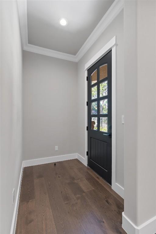 8 Cove Creek Ln, Austin, TX 78738 - foyer featuring crown molding and dark wood-type flooring
