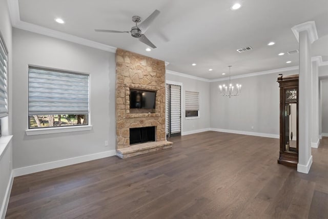 8 Cove Creek Ln, Austin, TX 78738 - unfurnished living room with a chandelier, a fireplace, ceiling fan, ornamental molding, and dark wood-style flooring