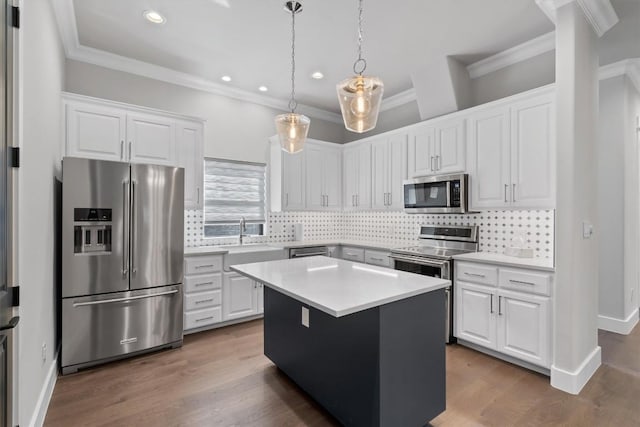 8 Cove Creek Ln, Austin, TX 78738 - kitchen featuring stainless steel appliances, recessed lighting, ornamental molding, and white cabinets