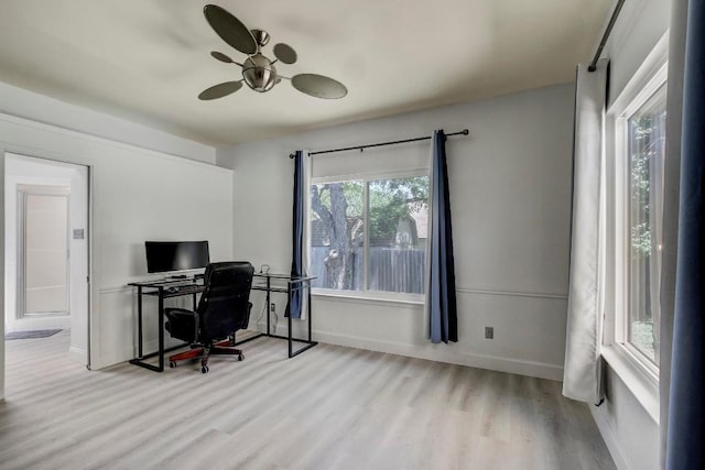 12319 Wycliff Ln, Austin, TX 78727 - home office featuring wood finished floors, a ceiling fan, and baseboards