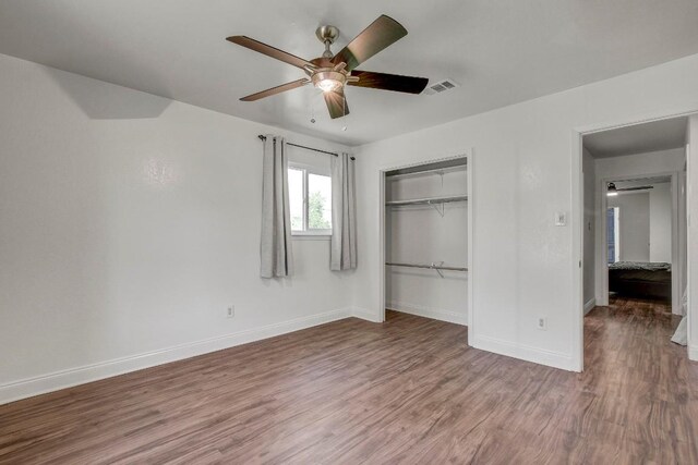 12319 Wycliff Ln, Austin, TX 78727 - unfurnished bedroom featuring wood finished floors, baseboards, a closet, and a ceiling fan