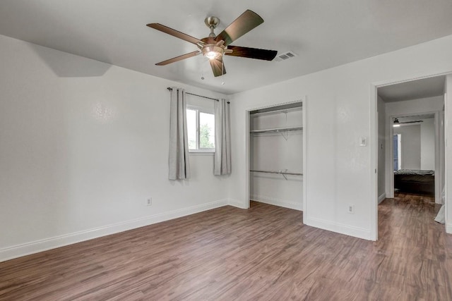 12319 Wycliff Ln, Austin, TX 78727 - unfurnished bedroom featuring wood finished floors, baseboards, a closet, and a ceiling fan