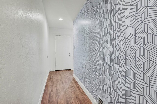 12319 Wycliff Ln, Austin, TX 78727 - hall with baseboards, wood finished floors, and recessed lighting
