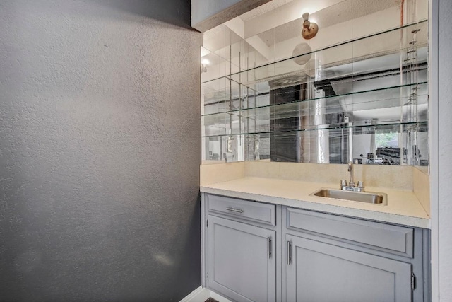 12319 Wycliff Ln, Austin, TX 78727 - bathroom featuring a textured wall and vanity