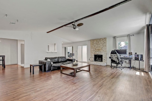 12319 Wycliff Ln, Austin, TX 78727 - living room with vaulted ceiling, light wood-type flooring, a fireplace, and baseboards