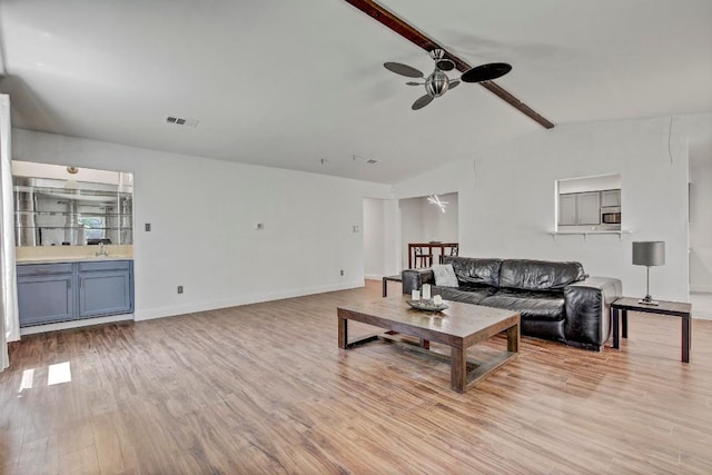 12319 Wycliff Ln, Austin, TX 78727 - living room featuring a ceiling fan, light wood-style flooring, and baseboards