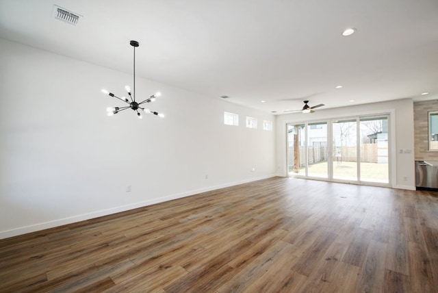 unfurnished living room with recessed lighting, wood finished floors, visible vents, and baseboards