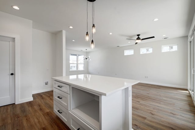 407 Delmar Ave Unit A, Austin, TX 78752 - kitchen featuring dark wood-type flooring, white cabinets, light countertops, recessed lighting, and a ceiling fan