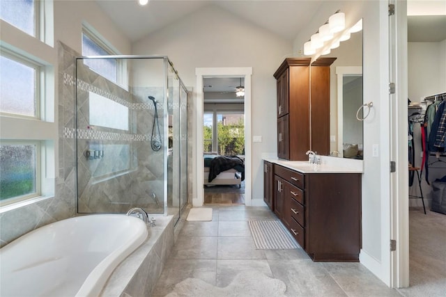 2500 Yuma Trl, Leander, TX 78641 - ensuite bathroom with vanity, a shower stall, a garden tub, a spacious closet, and a ceiling fan