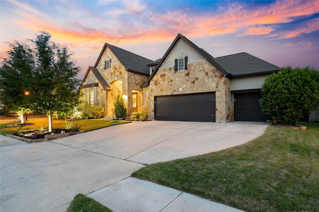 2500 Yuma Trl, Leander, TX 78641 - french country inspired facade featuring stone siding, driveway, a front yard, a garage, and stucco siding