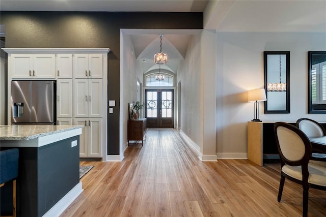 2500 Yuma Trl, Leander, TX 78641 - entrance foyer with a chandelier and light wood-style flooring