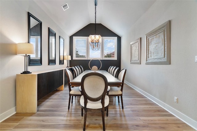 2500 Yuma Trl, Leander, TX 78641 - dining room featuring a chandelier, vaulted ceiling, and light wood-style floors