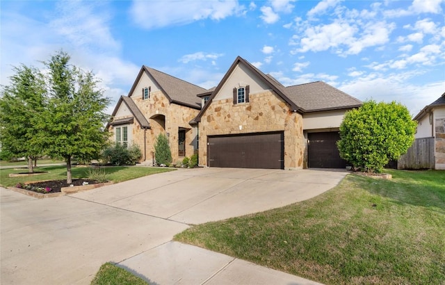 2500 Yuma Trl, Leander, TX 78641 - french country home featuring stone siding, driveway, and an attached garage