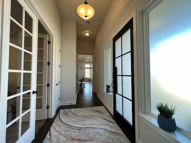 4201 Arques Ave, Round Rock, TX 78681 - hall with french doors, dark wood-type flooring, and baseboards