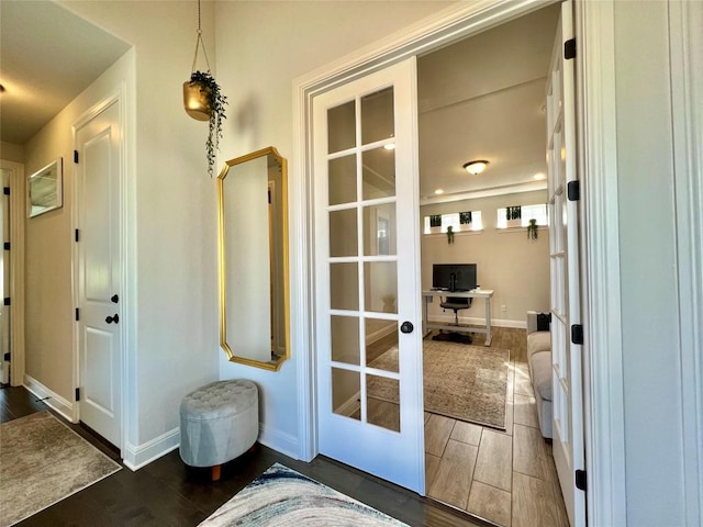 4201 Arques Ave, Round Rock, TX 78681 - entryway with wood finished floors, a desk, and baseboards