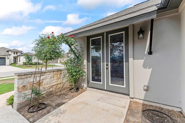 4201 Arques Ave, Round Rock, TX 78681 - doorway to property featuring stucco siding, roof with shingles, and a porch