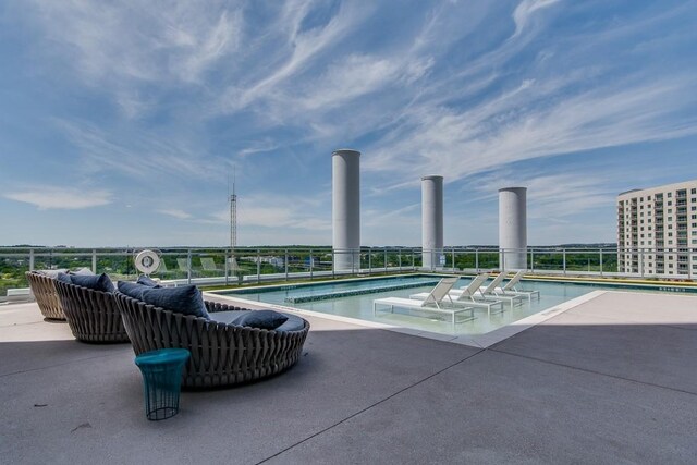 community pool featuring a patio area