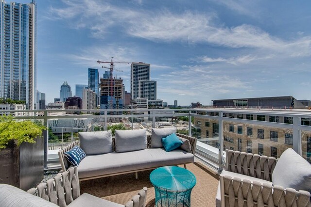 balcony featuring a view of city and an outdoor hangout area