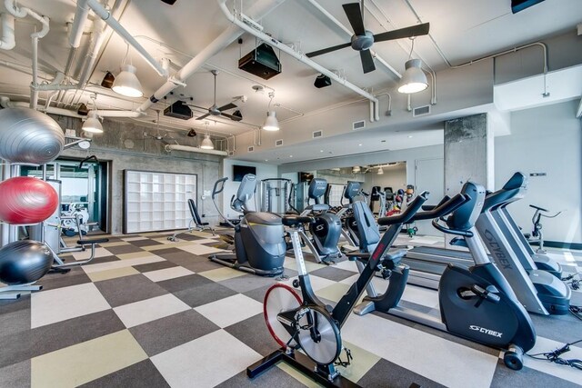 workout area with visible vents and ceiling fan