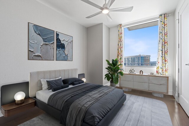 bedroom featuring a ceiling fan and wood finished floors