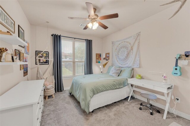bedroom with light colored carpet, baseboards, a ceiling fan, and visible vents