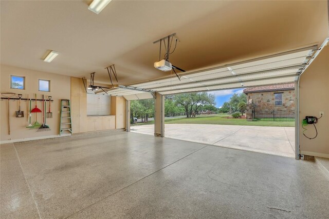 garage featuring baseboards and a garage door opener