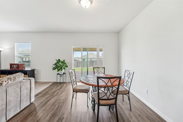 12700 Robert Taft St, Manor, TX 78653 - dining space featuring wood finished floors and healthy amount of natural light