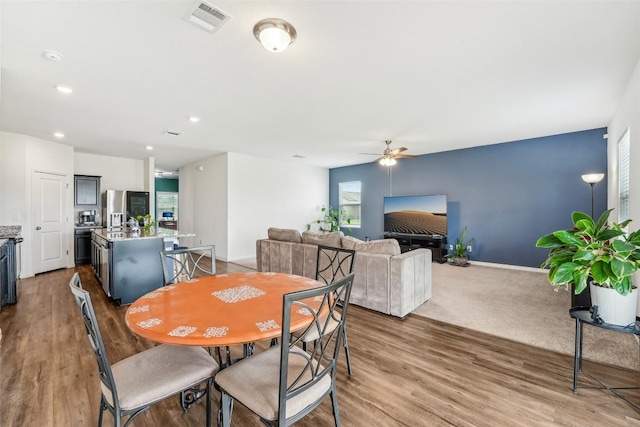 12700 Robert Taft St, Manor, TX 78653 - dining room with ceiling fan, wood finished floors, and recessed lighting