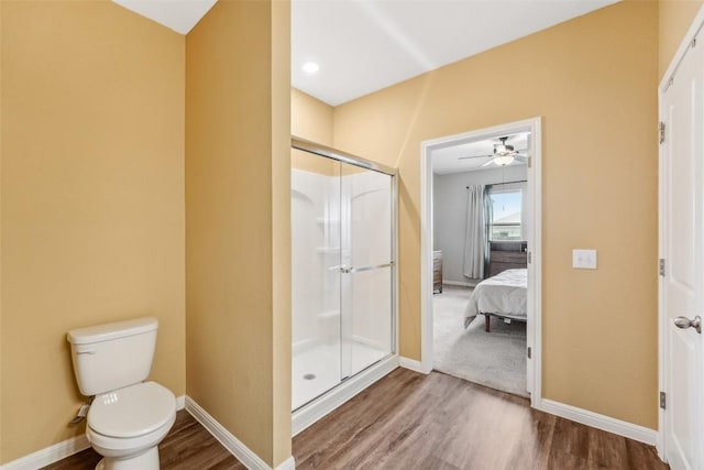 12700 Robert Taft St, Manor, TX 78653 - full bathroom with a shower stall, wood finished floors, ensuite bathroom, and a ceiling fan
