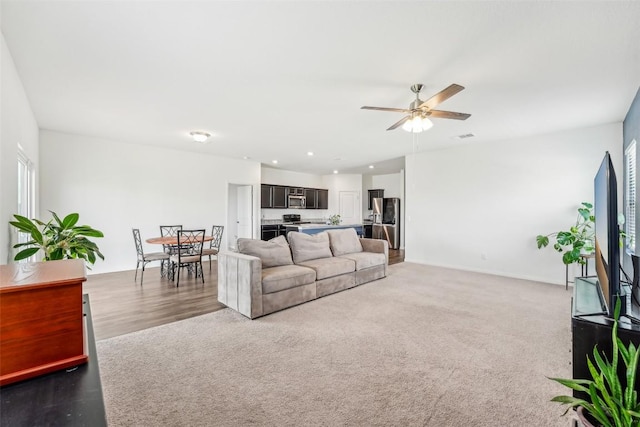 12700 Robert Taft St, Manor, TX 78653 - living area featuring ceiling fan, carpet flooring, and plenty of natural light