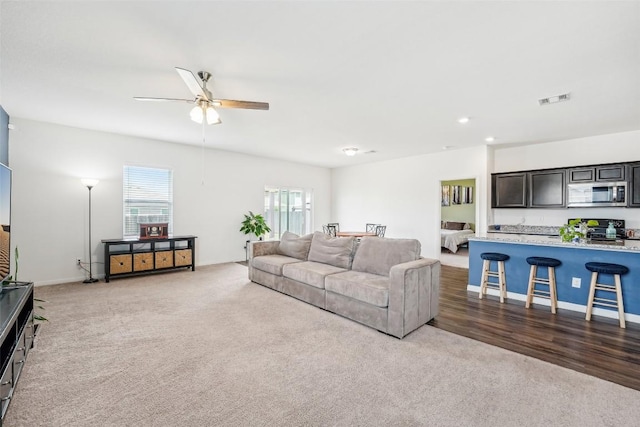 12700 Robert Taft St, Manor, TX 78653 - living area with carpet, a ceiling fan, and recessed lighting