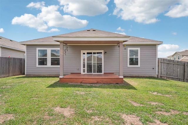 12700 Robert Taft St, Manor, TX 78653 - back of house featuring a deck and a fenced backyard