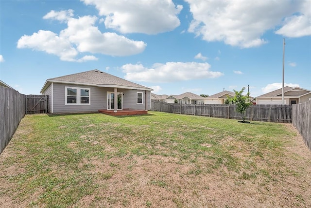 12700 Robert Taft St, Manor, TX 78653 - back of house with a fenced backyard and a deck