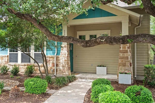 view of exterior entry with stone siding
