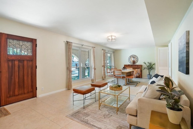 11204 Deadoak Ln, Austin, TX 78759 - living room featuring light tile patterned floors and baseboards