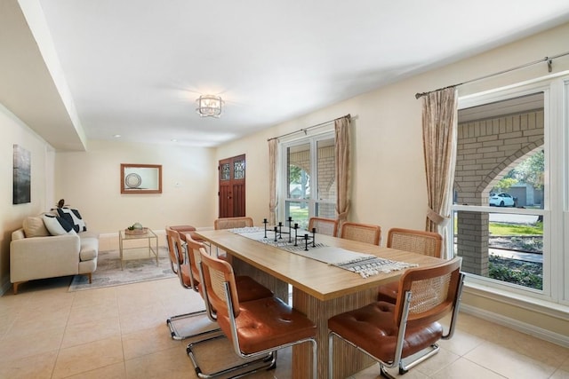 11204 Deadoak Ln, Austin, TX 78759 - dining room featuring light tile patterned floors and baseboards